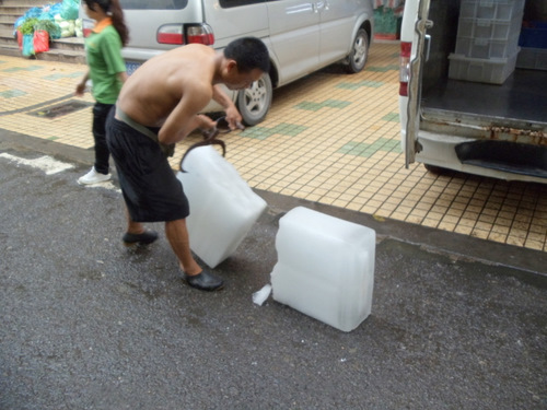 The Ice Man brings ice to the Market.